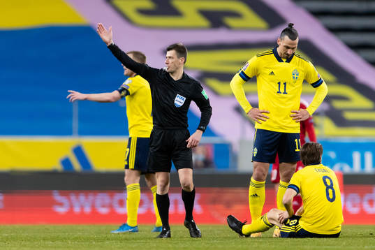 Referee Bastien Benoit and Albin Ekdal of Sweden