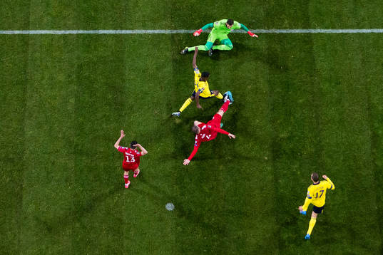 Alexander Isak of Sweden and goalkeeper Giorgi Loria of