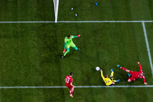 Viktor Claesson of Sweden scores 1-0 passed goalkeeper