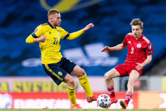 Dejan Kulusevski of Sweden and Saba Lobzhanidze of Georgia