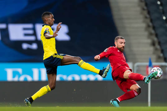 Alexander Isak of Sweden and Guram Kashia of Georgia