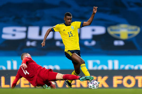 Guram Kashia of Georgia and Alexander Isak of Sweden
