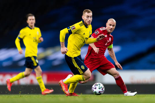 Dejan Kulusevski of Sweden and Jaba Kankava of Georgia