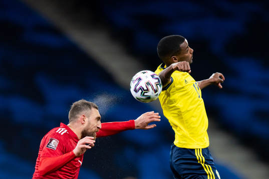 Guram Kashia of Georgia and Alexander Isak of Sweden