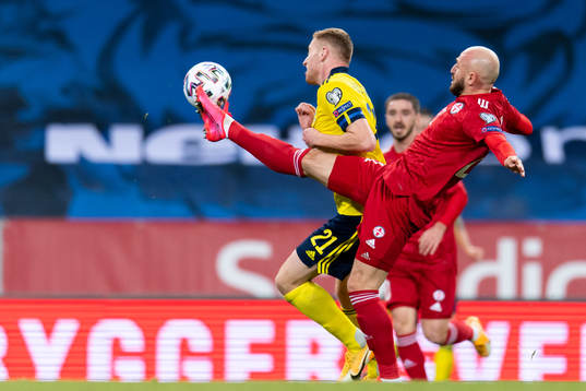 Dejan Kulusevski of Sweden and Valerian Gvilia of Georgia
