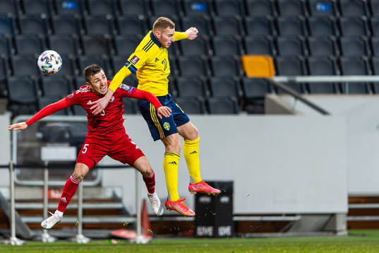Guram Giorbelidze of Georgia competes for the ball with