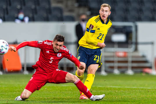 Dejan Kulusevski of Sweden and Guram Giorbelidze of Georgia