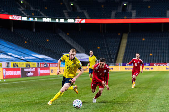 Dejan Kulusevski of Sweden and Guram Giorbelidze of Georgia