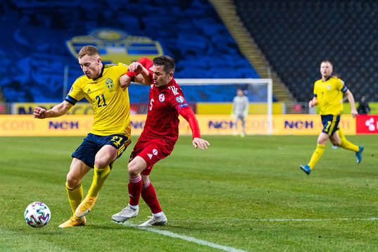 Dejan Kulusevski of Sweden and Guram Giorbelidze of Georgia