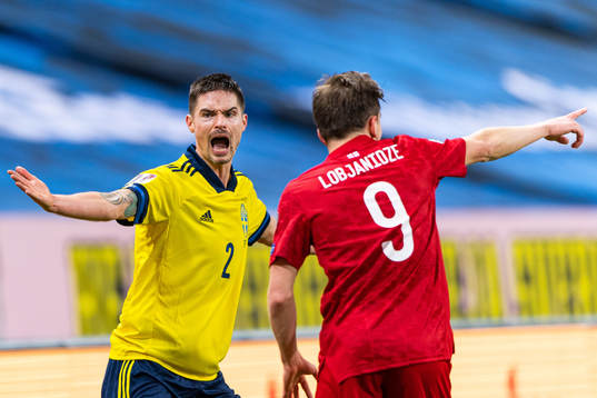Mikael Lustig of Sweden reacts against the referee