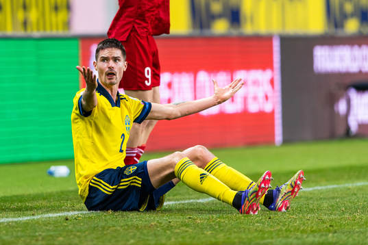 Mikael Lustig of Sweden reacts against the referee