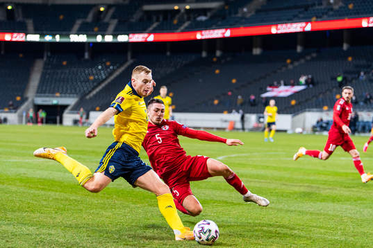Dejan Kulusevski of Sweden and Guram Giorbelidze of Georgia