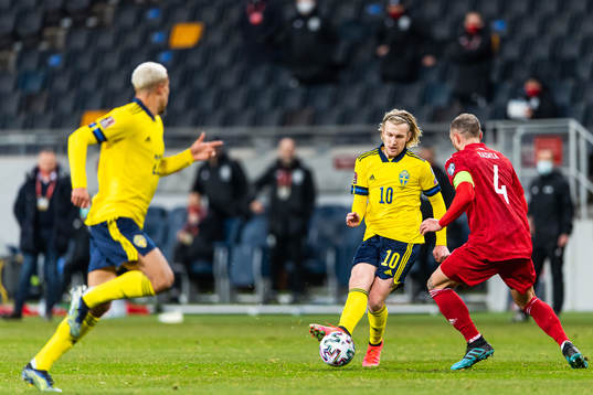 Emil Forsberg of Sweden and Guram Kashia of Georgia