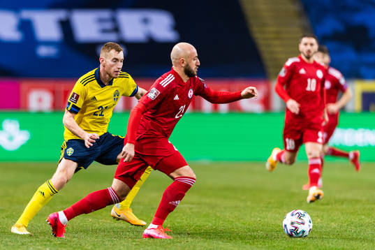 Dejan Kulusevski of Sweden and Valerian Gvilia of Georgia
