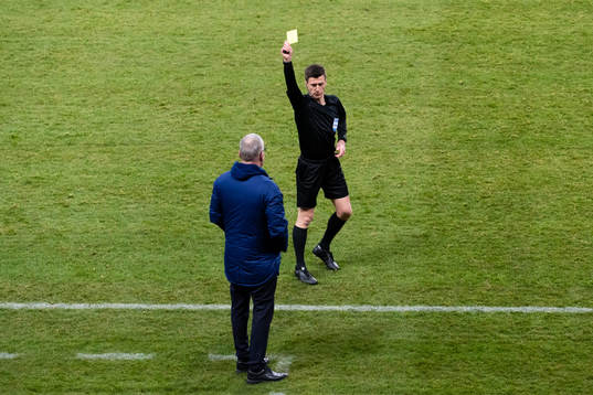 Janne Andersson, head coach of Sweden is shown a yellow card