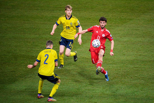 Mikael Lustig and Filip Helander of Sweden against Giorgi