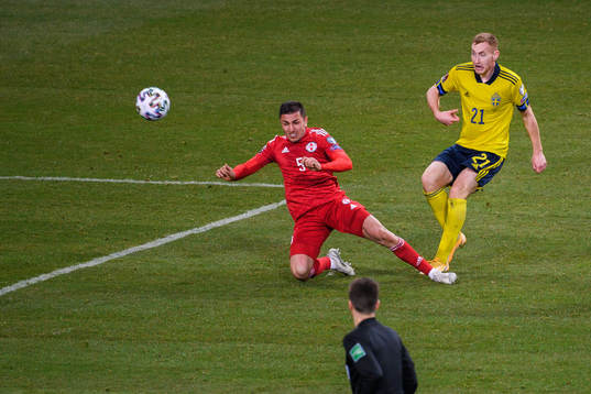 Guram Giorbelidze of Georgia and Dejan Kulusevski of Sweden