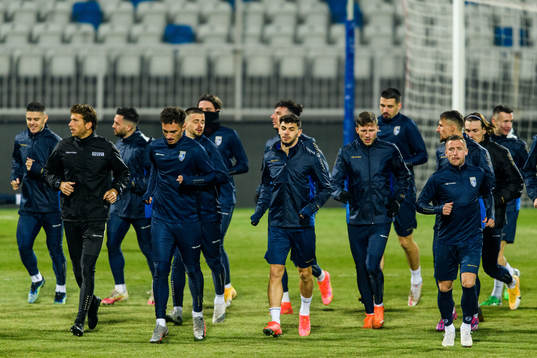 Players of the Kosovo national football team warm up