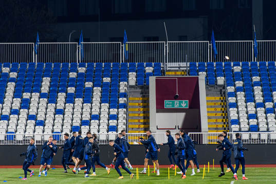 Players of the Kosovo national football team warm up