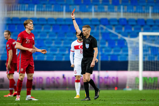 Kristian Thorstvedt of Norway receives a red card from
