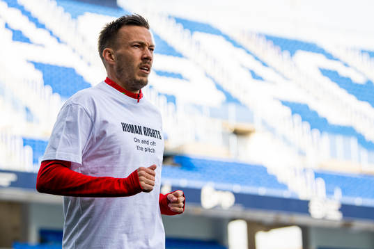 Martin Linnes of Norway warms up wearing a t-shirt with the