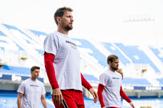 Stefan Strandberg of Norway warms up wearing a t-shirt with