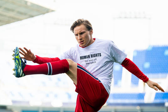 Jonas Svensson of Norway warms up wearing a t-shirt with