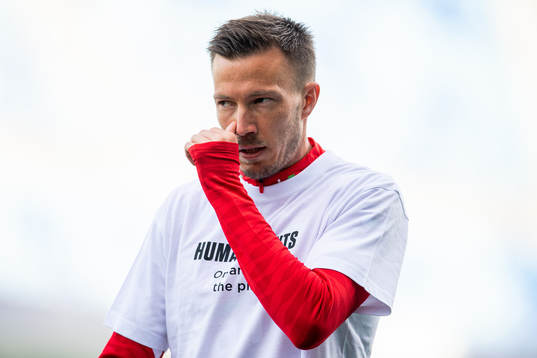 Martin Linnes of Norway warms up wearing a t-shirt with the