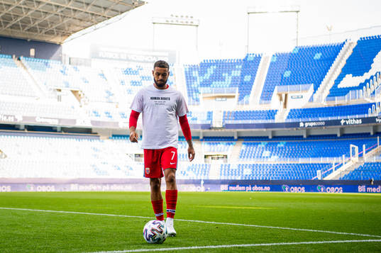 Joshua King of Norway warms up wearing a t-shirt with the