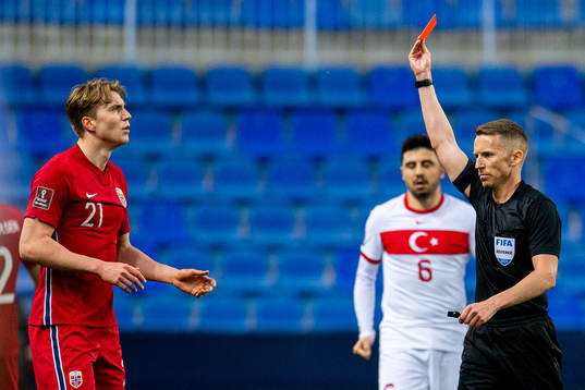 Kristian Thorstvedt of Norway receives a red card from