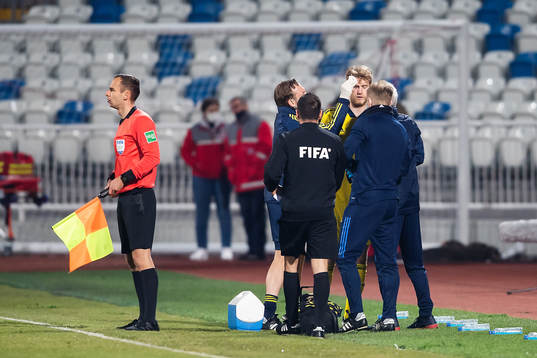 Filip Helander of Sweden receives medical treatment