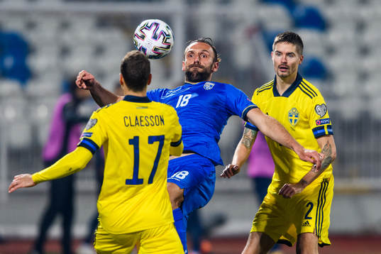 Vedat Muriqi of Kosovo and Mikael Lustig of Sweden