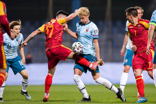Sead Haksabanovic of Montenegro and Morten Thorsby of Norway