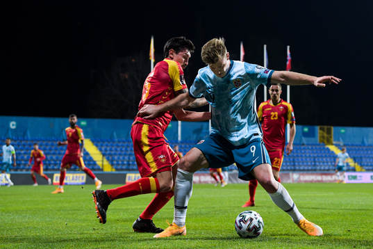Stefan Savic of Montenegro and Alexander Sørloth of Norway