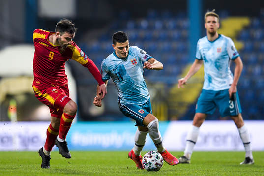 Dino Islamovic of Montenegro and Mohamed Elyounoussi of
