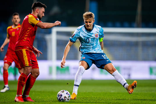 Sead Haksabanovic of Montenegro and Martin Ødegaard of