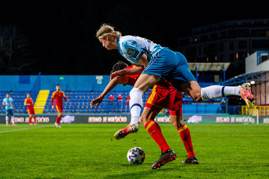Stefan Savic of Montenegro and Erling Braut Haaland of