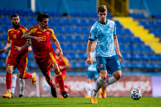 Stefan Savic of Montenegro and Alexander Sørloth of Norway