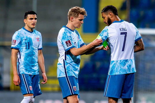 Martin Ødegaard of Norway gives the captain’s armband to