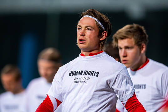Patrick Berg of Norway warms up wearing a t-shirt with the