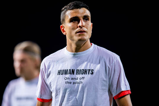 Mohamed Elyounoussi of Norway warms up wearing a t-shirt