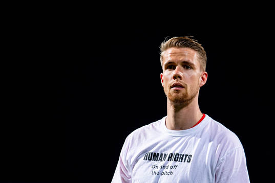 Kristoffer Ajer of Norway warms up wearing a t-shirt with
