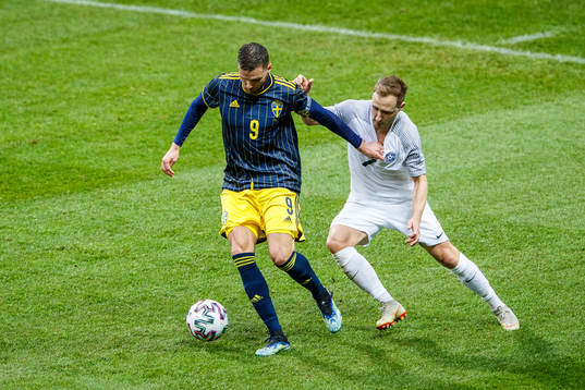 Marcus Berg of Sweden and Sander Puri of Estonia