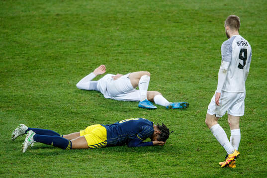 Jens-Lys Cajuste of Sweden and Henri Anier of Estonia in