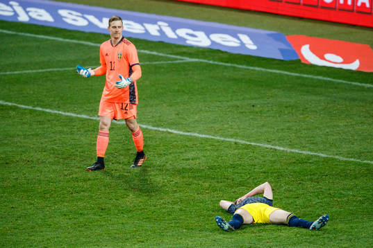 goalkeeper Karl-Johan Johnsson and Emil Krafth of Sweden