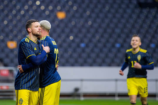 Marcus Berg and Robin Quaison of Sweden celebrate