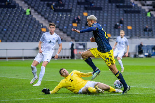 goalkeeper Matvei Igonen of Estonia and Robin Quaison of