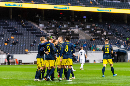 Marcus Berg celebrates with Jens-Lys Cajuste, Robin Quaison