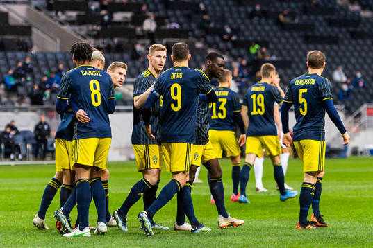 Marcus Berg celebrates with Jens-Lys Cajuste, Robin Quaison