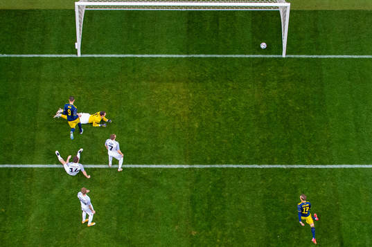 Marcus Berg of Sweden scores 1-0 beyond goalkeeper Matvei